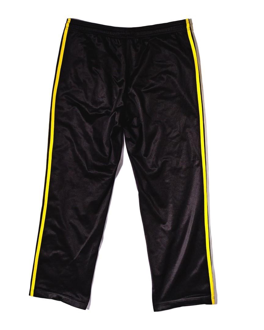 Black adidas pants with yellow stripes on sale